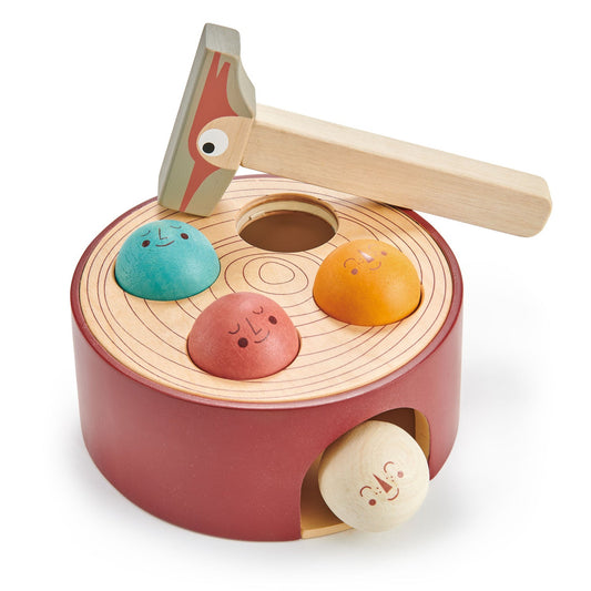 Solid beech tap game shaped like a tree-stump with three painted critters and a woodpecker hammer