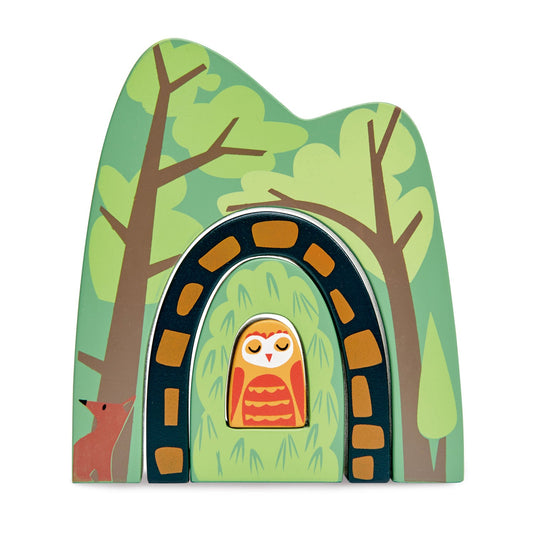 Painted plywood forest tunnel arch with an owl tucked inside the tunnel mouth and a fox peering from the trees