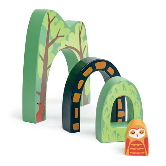 Four interlocking forest tunnel pieces arranged side by side in a row