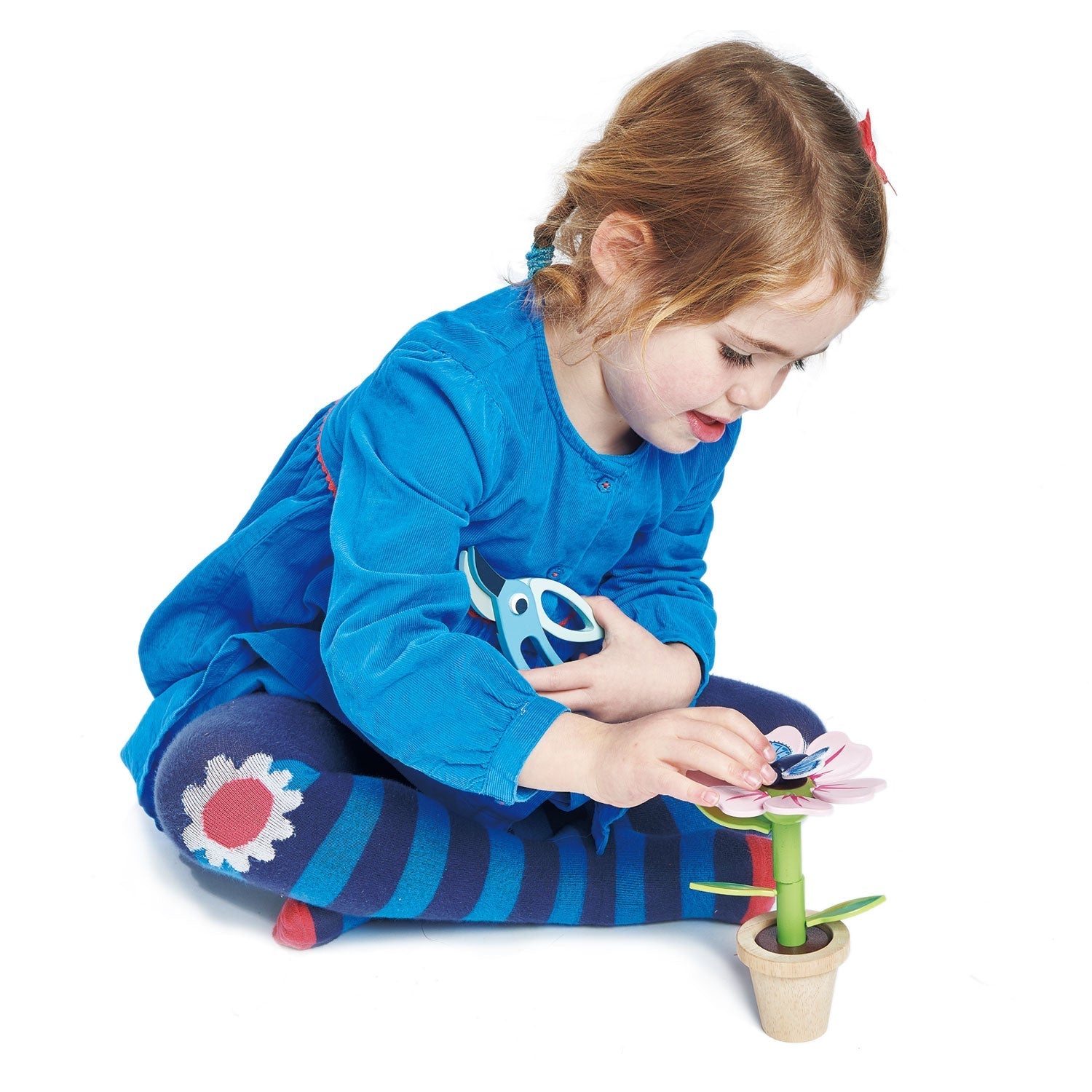 Pollinator flowerpot with butterfly perched and bird-beak pruners in hand